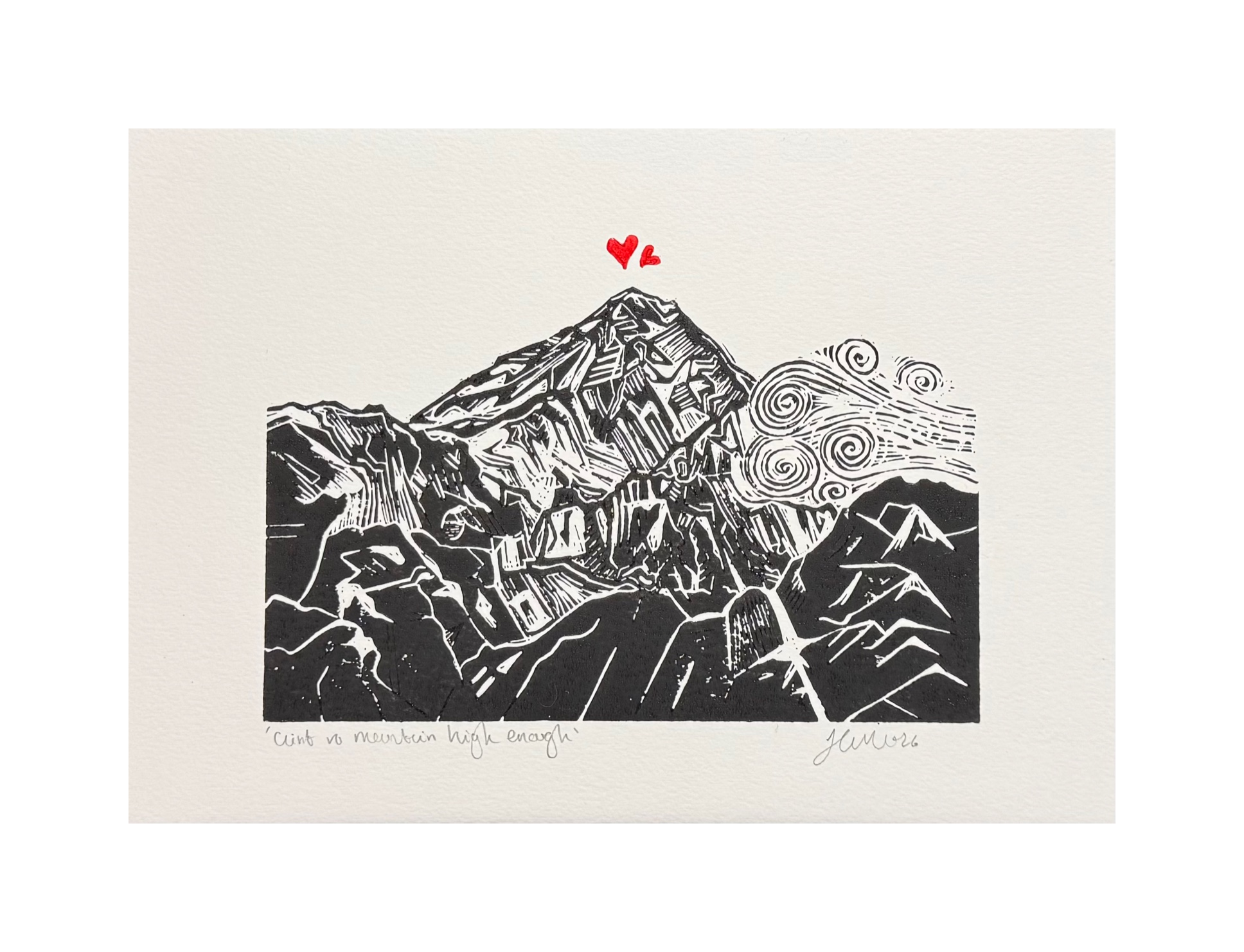 Handmade linocut mountain and love heart print, unframed, black and red ink on white textured paper, A4 size, overhead product shot