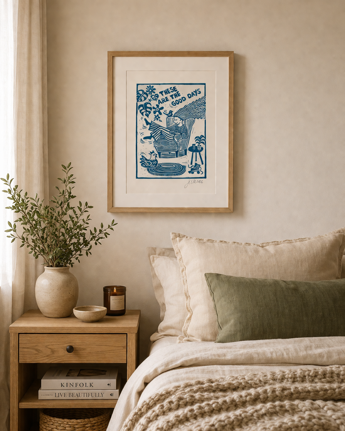 Bedroom with framed artwork, plant, and nightstand
