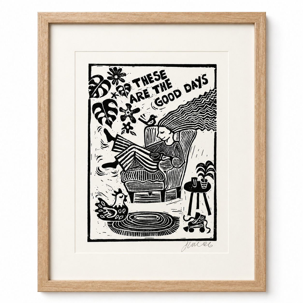 Framed black and white illustration with 'These Are The Good Days' text, featuring a person lounging on a chair.
