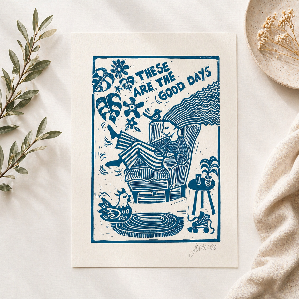 Blue illustration of a person in a chair with text 'These are the good days' on a white background.