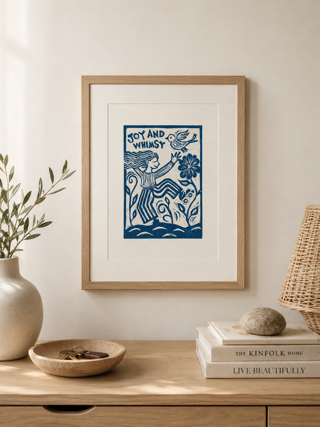Framed artwork on a wooden surface with decor items