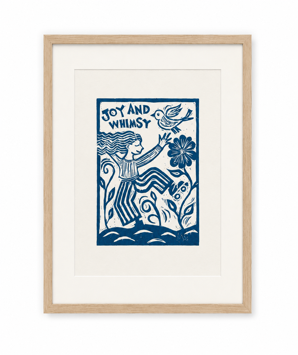 Framed artwork with a blue illustration of a person holding a flower and a bird, with 'Joy and Whimsy' text, on a white background.