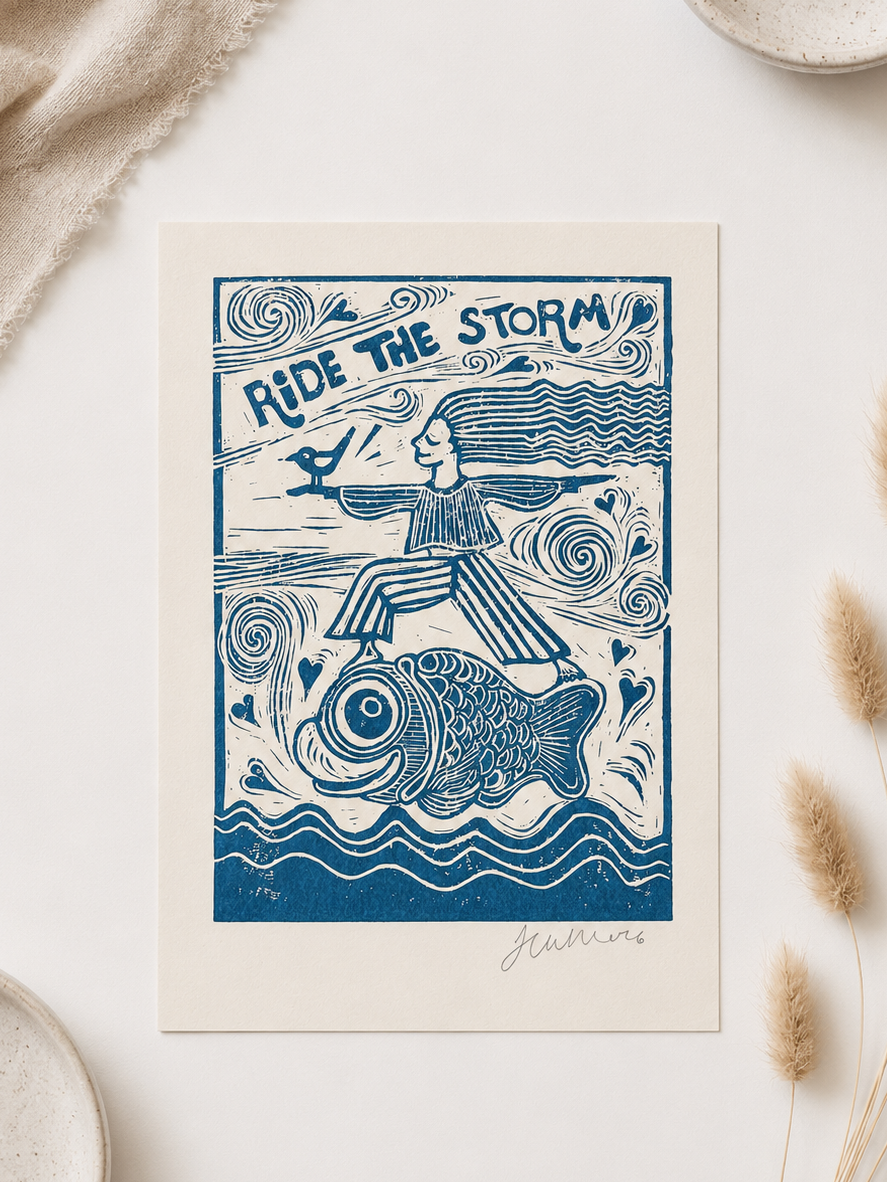 Framed artwork with 'Ride the Storm' design on a white surface with decorative elements.