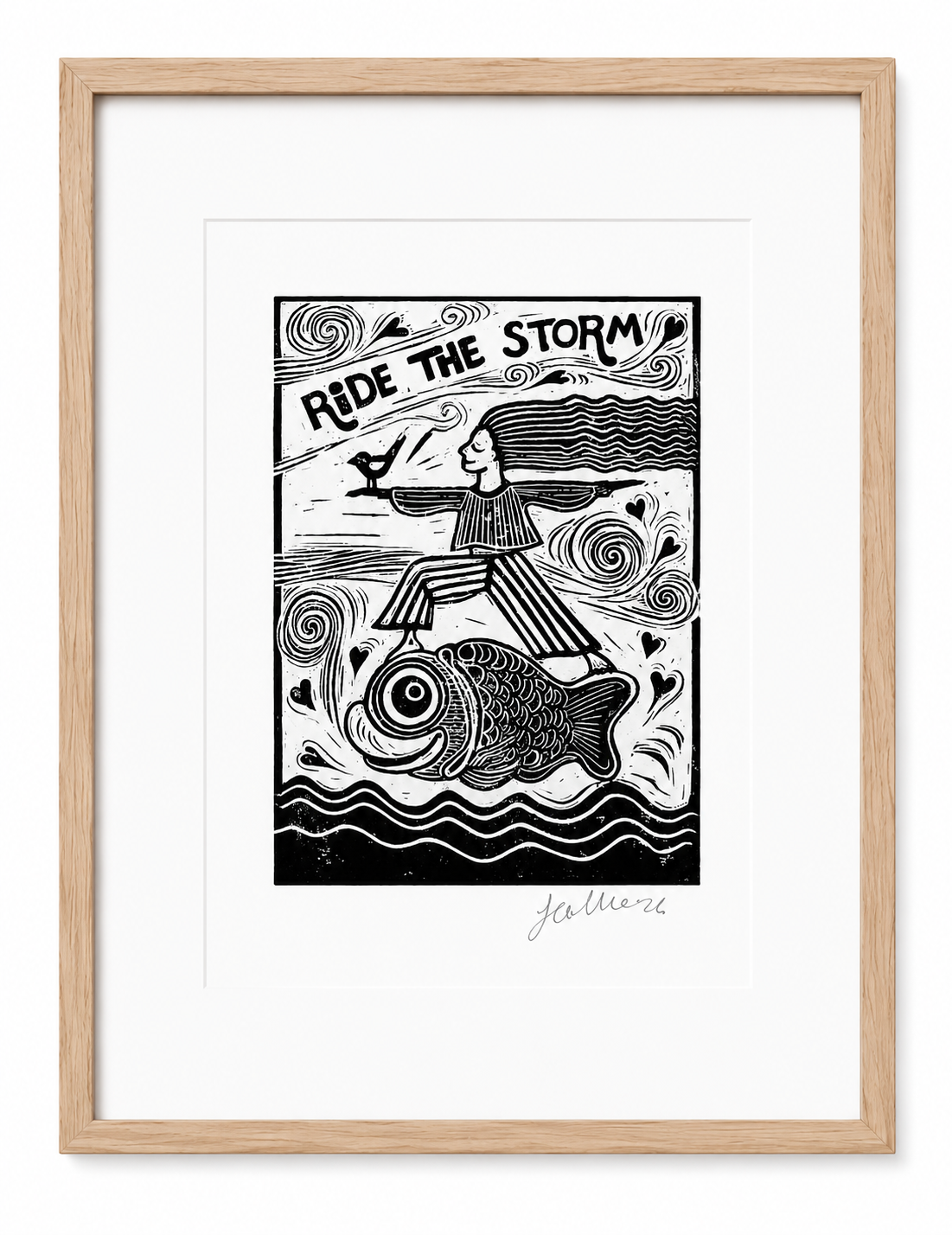 Framed artwork with a black and white illustration of a person riding a fish, titled 'Ride the Storm'.
